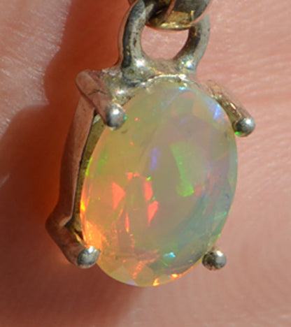 Precious opal. Completely clear with a fantastic play of colour with ranges covering the entire spectrum.